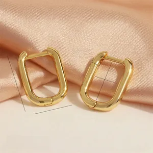 Macro shot showing dimensions of a 18K gold plated geometric U-shaped chunky earring