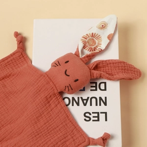 Cotton baby comforter towel in brick red featuring cute rabbit head with embroidered details