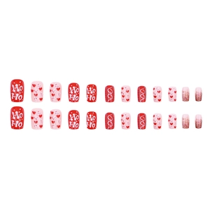 Christmas press-on nails set with 24 red and pink pieces featuring festive HO HO patterns