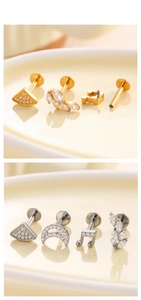 Detail view of titanium stud earrings set with zircon in leaf and crescent moon shapes
