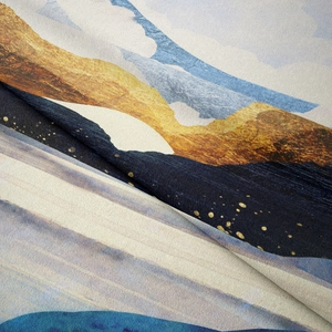 Detailed macro view showing the soft fabric texture and abstract gold mountain print