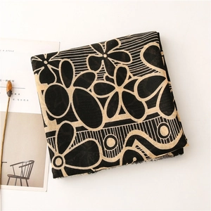 Floral print cotton linen scarf featuring elegant tassels and minimalist layout