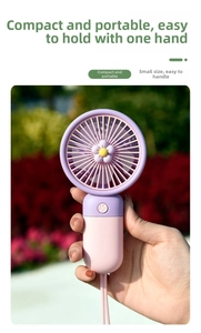 Close-up of pink and purple mini fan with daisy decor and a lanyard in outdoor setting