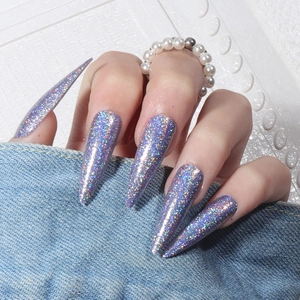 Long stiletto press-on nails featuring holographic purple laser glitter finish