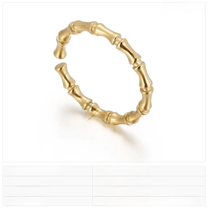 Detail of 2mm bamboo texture stainless steel open ring with polished gold finish