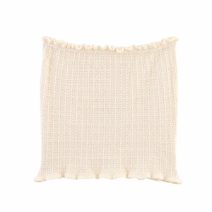 Detailed view of cream knitted tube top featuring delicate ruffled edges and ribbed texture