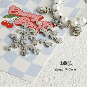 Detail of 7x7mm silver butterfly DIY charms for Y2K jewelry making projects