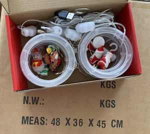 Detail of Christmas LED curtain lights with Santa figurines and USB power connection