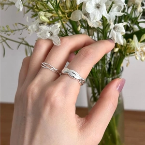 Detail showing layers of fine 925 sterling silver twist and intertwined line rings
