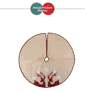 Detail view of beige Christmas tree skirt featuring reindeer and snowflake embroidery