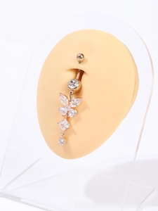 Detailed view of rose gold butterfly belly ring with AAA cubic zirconia on silicone model