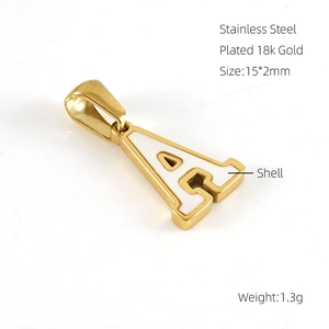 Detailed view of 18k gold plated stainless steel letter A pendant with shell inlay
