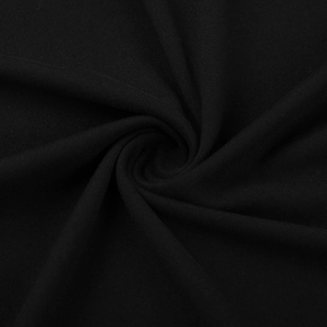 Vue macro détaillée de la texture du tissu en maille noire avec drapé plissé élégant