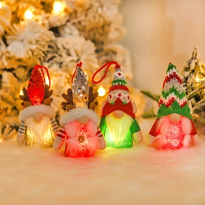 Set of four glowing Christmas forest gnome plush ornaments with LED lights and knit sequins