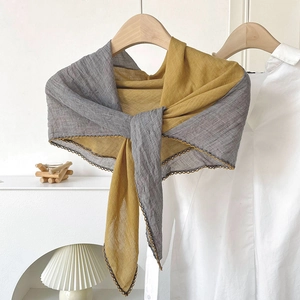 Minimalist grey and yellow cotton linen scarf with contrast stitching on a wooden hanger