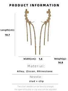 Detailed view of golden leaf tassel earrings with length and width dimensions