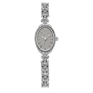 Montre femme ovale en argent avec chiffres romains et bracelet gourmette à motifs floraux