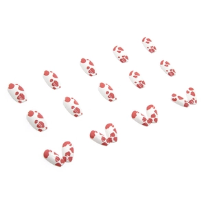 Pink cow print press-on nails set in medium trapezoid ballerina shape on white background