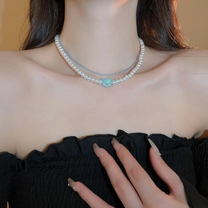 Double-layer pearl choker with a light blue heart pendant and navy blue micro-beads