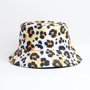 Stylish leopard print bucket hat with wide brim in white yellow and orange leopard patterns