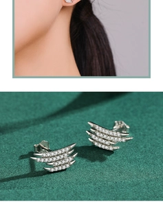 Detail of S925 silver wing-shaped stud earrings with full diamonds on model and display