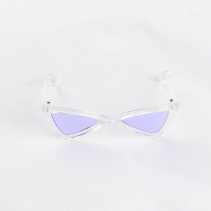 Detail of triangular cat sunglasses with purple lenses and transparent plastic frames