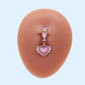 Pink heart navel ring with crystal wings on model, stainless steel body jewelry