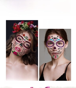 Detailed view of Day of the Dead face tattoo stickers with colorful sugar skull designs