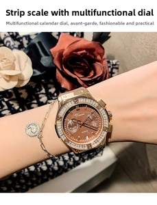 Close-up of gold quartz watch with crystal bezel and brown multi-function dial on wrist