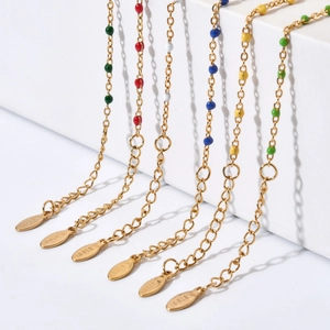 Detailed macro view of colorful beaded stainless steel bracelets with 18K gold plating