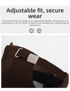 Detail of adjustable metal silver buckle with engraved logo on brown cotton baseball cap