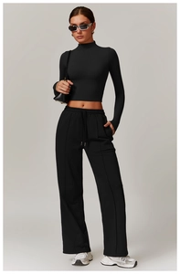 Close-up of high-waist loose drawstring sweatpants with functional side pockets