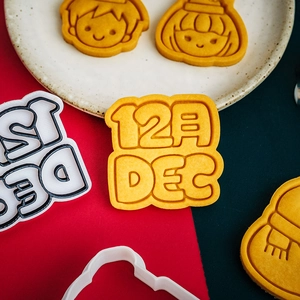 Mini Christmas cartoon cookie cutters featuring boy and girl portraits and DEC text patterns