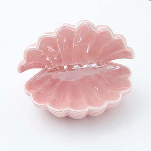 Detailed view of glossy pink ceramic shell tray for jewelry and home decoration