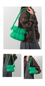 Fashionable bright green puffer cloud bag worn as a crossbody and shoulder style
