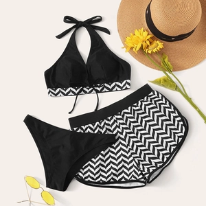 Three-piece striped swimwear set with halter top, bikini bottom and patterned boy shorts