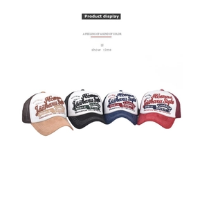 Detailed view of 3D embroidered trucker hats in four colors with breathable mesh back