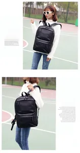 Detail view of stylish black PU leather men's backpack with dual zipper pockets on the back