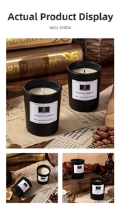 Detail of minimalist black matte scented candle with white label and natural wick in home setting