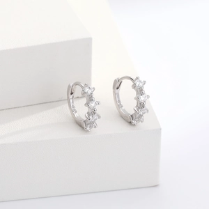 Detailed close-up of S925 silver hoop earrings with clear round cubic zirconia stones