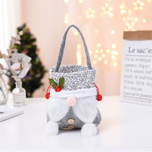 Close-up of Christmas gnome gift bag featuring soft plush beard and wooden button detail
