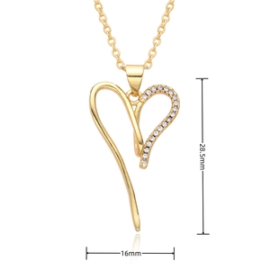 Detail view of gold heart pendant with cubic zirconia and dimensions 28.5mm x 16mm