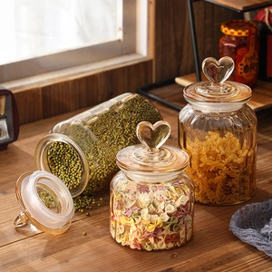 Amber ribbed glass storage jar with heart handle and airtight lid for snacks
