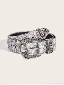 Detail of western retro belt with silver sequins, floral engraved buckle and star studs