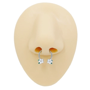 Stainless steel horseshoe nose ring with white camellia flower and green leaves on a model