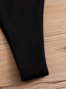 Macro shot of high-quality black ribbed fabric texture for sexy bikini swimwear detail