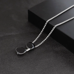 Hip hop style stainless steel necklace featuring a creative black sunglasses pendant
