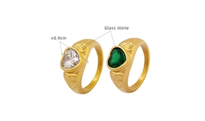 Detail of gold heart rings featuring 0.9cm clear and green glass stones with ornate carvings