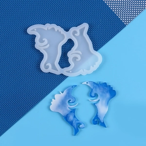 Detail of transparent seahorse silicone mold with blue and white resin pendant examples