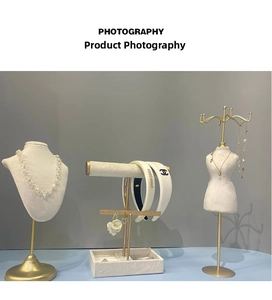 Detail of luxury jewelry display stand with pearl necklace and chic hair accessories